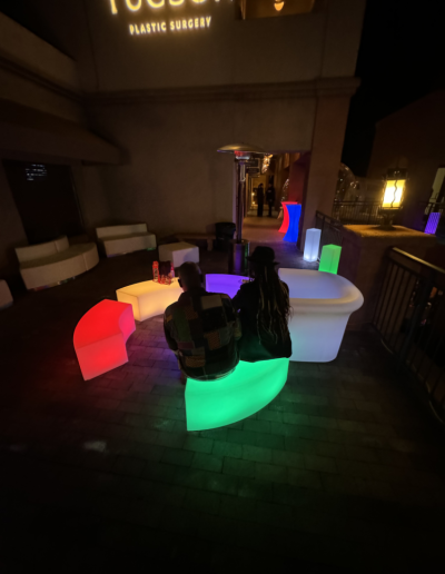 illuminated lounge set being used by people