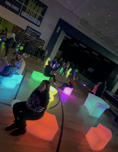 people using illuminated furniture at event